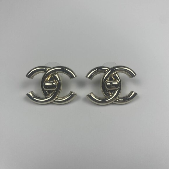 CHANEL Pre-Owned 1995 Gold Tone Turn Rock CC Clip On Earrings - Picture 1 of 9